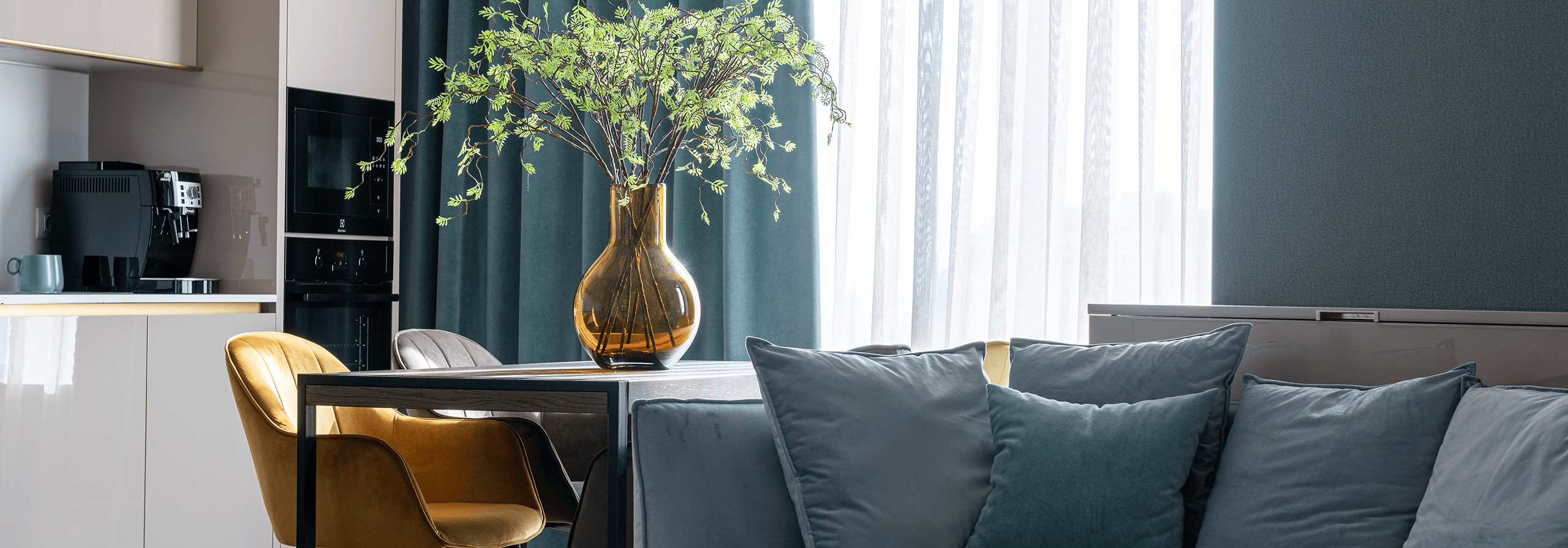 couch with a table and vase next to it